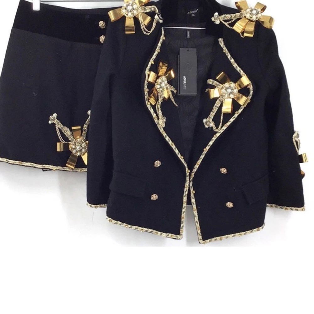 Elegant Black Blazer and Skirt Set with Gold Accents